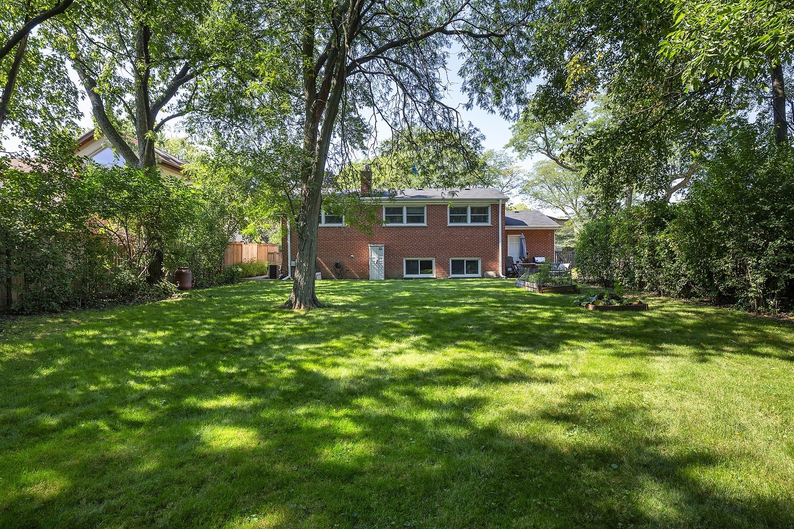 1345 Tinker Way Glenview, IL 60025 - Photo 23 of 25 a view of a house with a yard