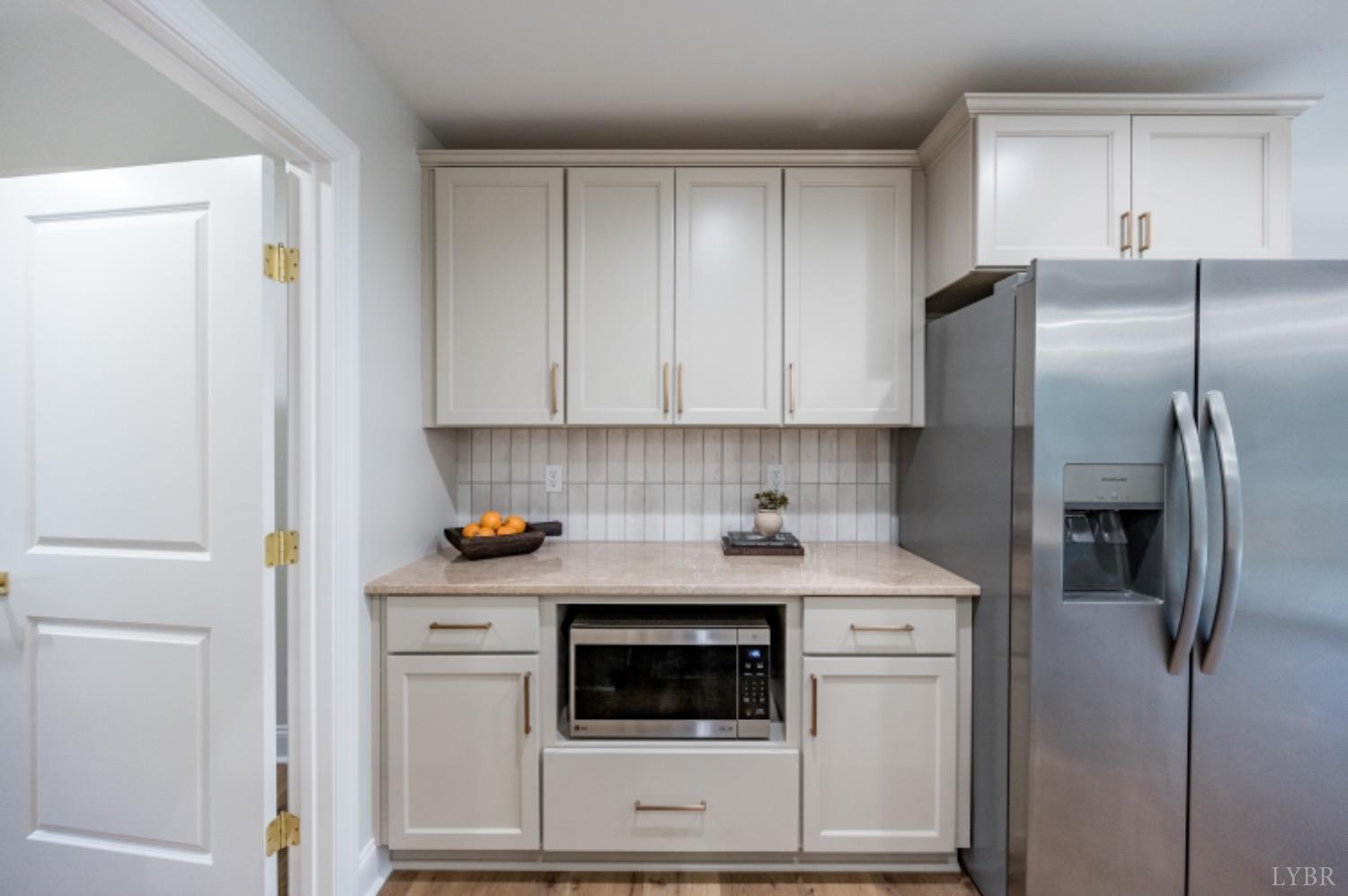 240 Ned Brown Road Amherst, VA 24521 - Photo 12 of 59 a kitchen with appliances cabinets and a counter top space