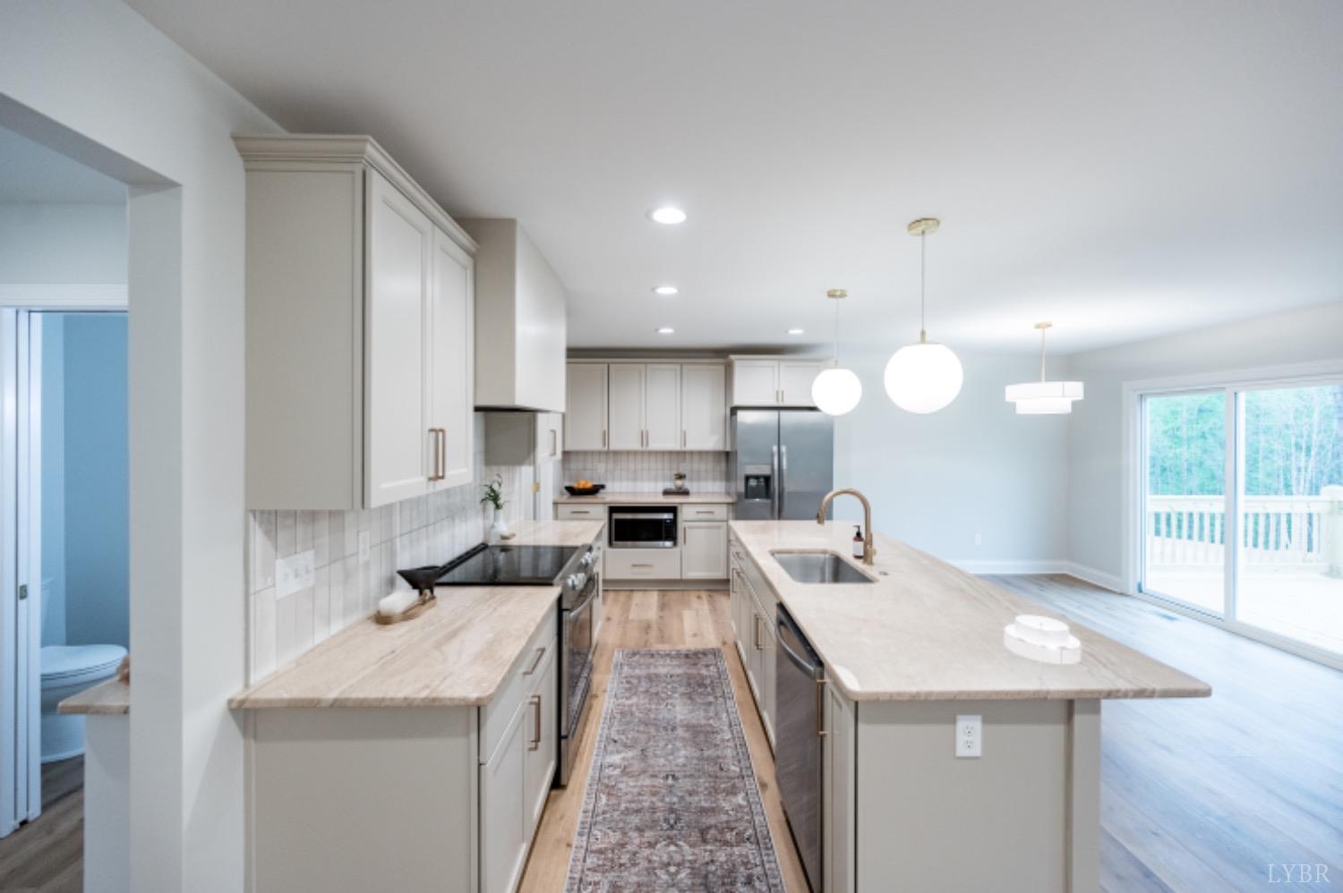 240 Ned Brown Road Amherst, VA 24521 - Photo 14 of 59 a kitchen with a sink a counter top space and appliances