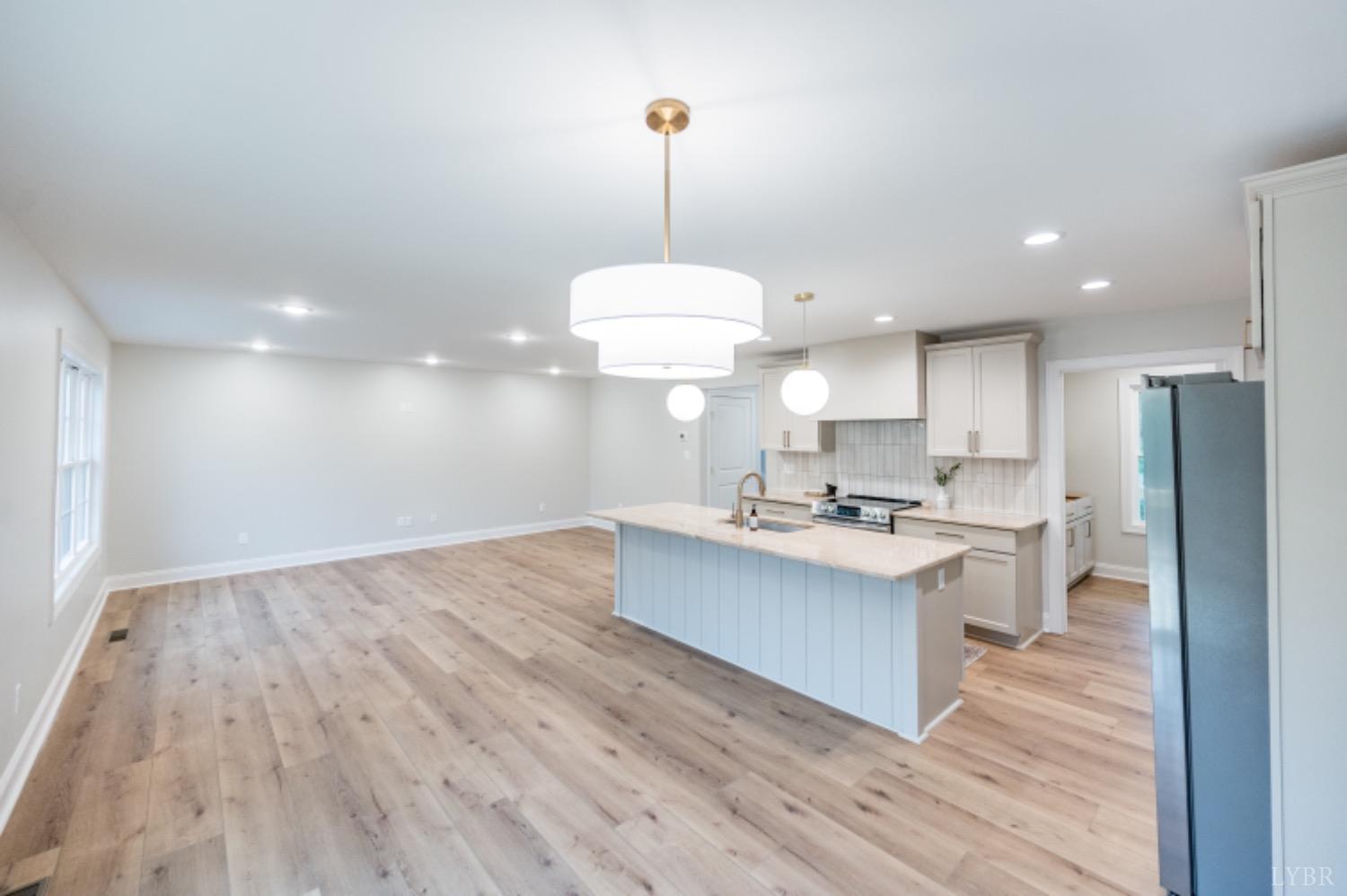 240 Ned Brown Road Amherst, VA 24521 - Photo 15 of 59 a kitchen with kitchen island a stove a counter top space and a center island