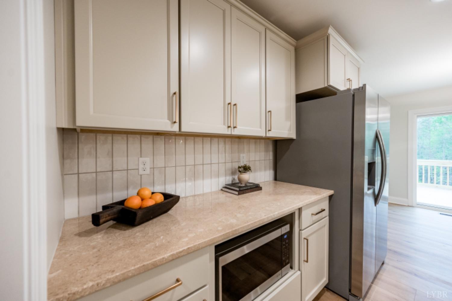 240 Ned Brown Road Amherst, VA 24521 - Photo 20 of 59 a kitchen with a sink and cabinets