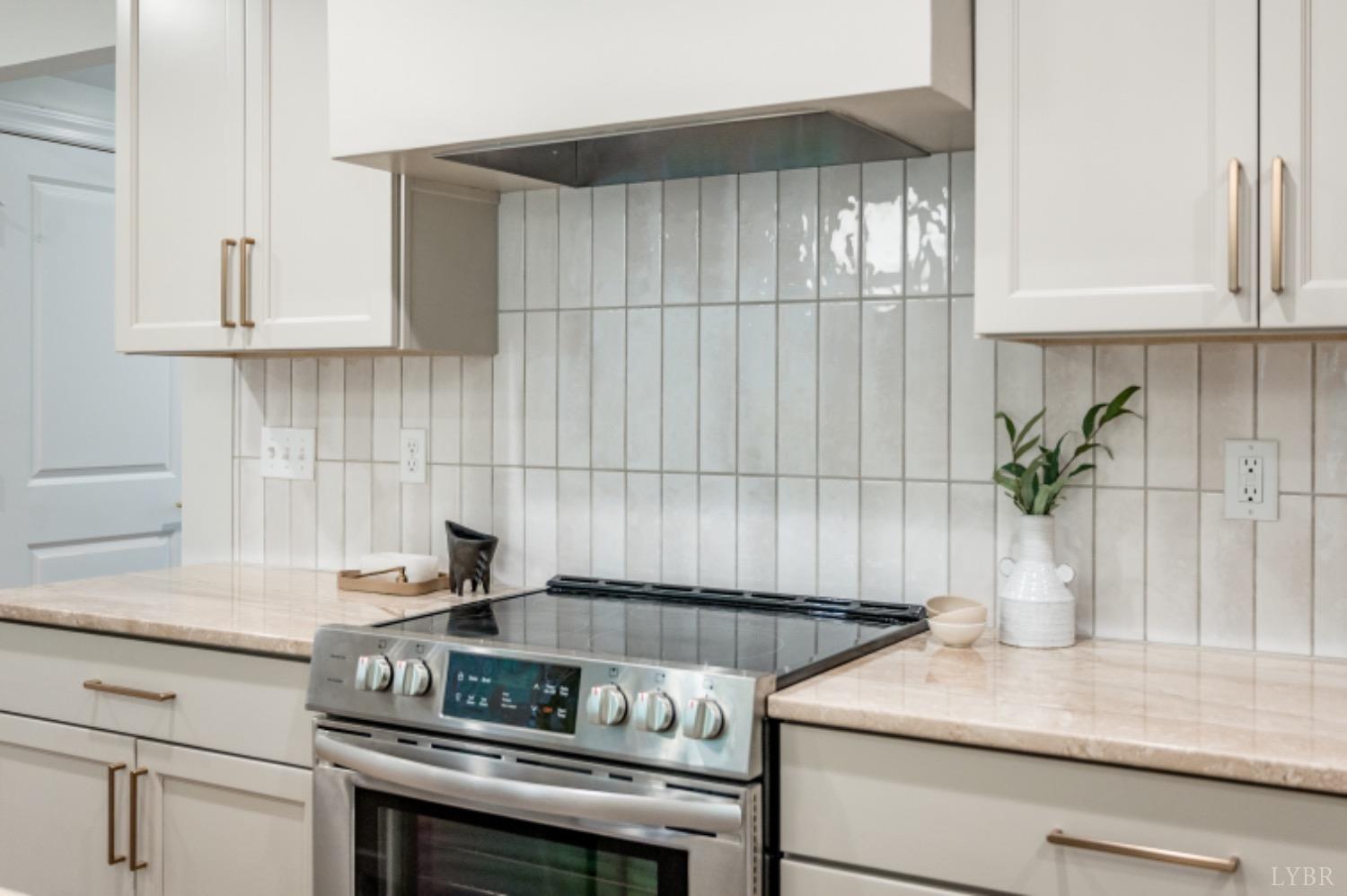 240 Ned Brown Road Amherst, VA 24521 - Photo 21 of 59 a kitchen with a stove and cabinets