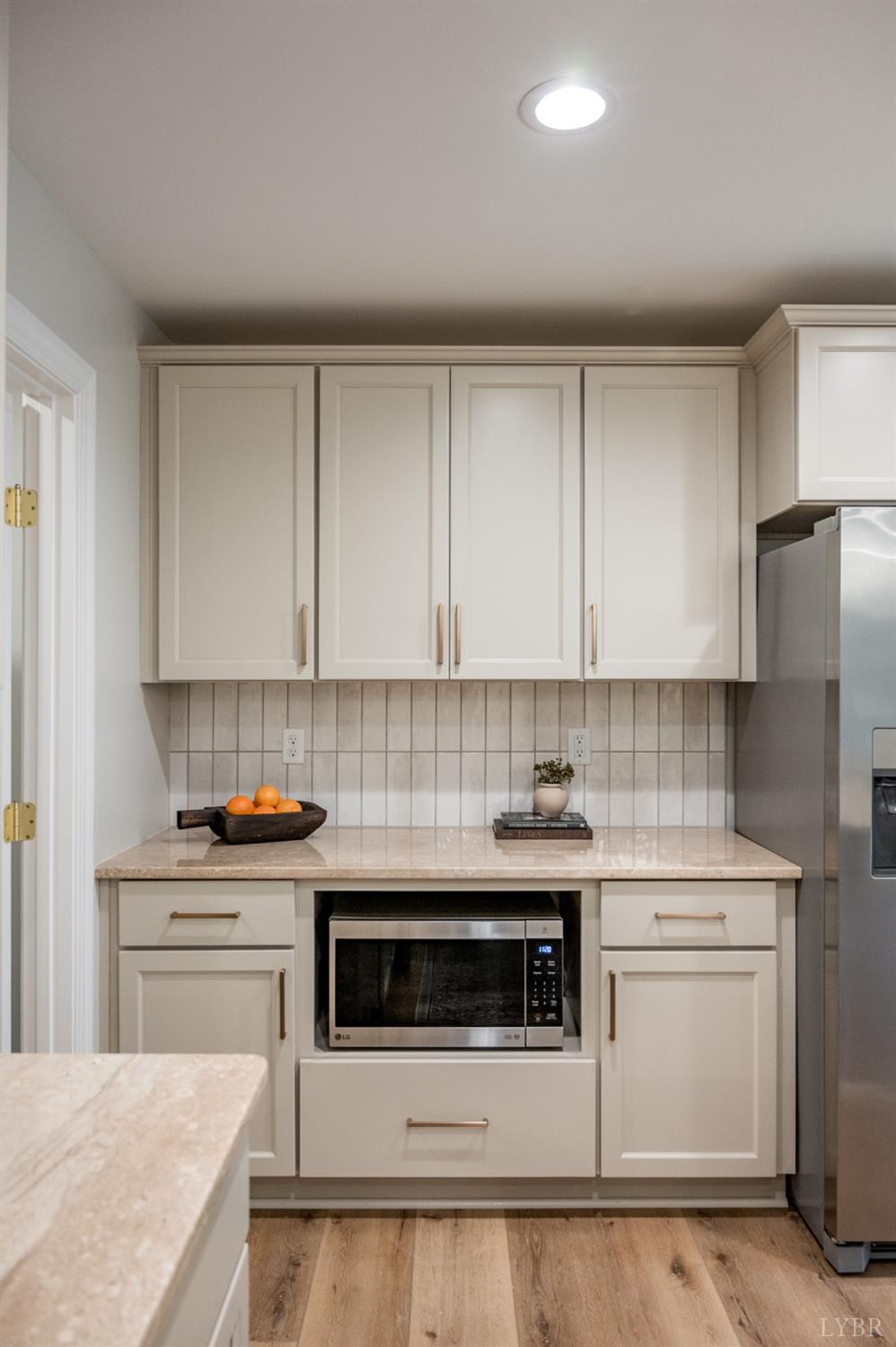 240 Ned Brown Road Amherst, VA 24521 - Photo 22 of 59 a kitchen with stainless steel appliances a stove a sink and a refrigerator