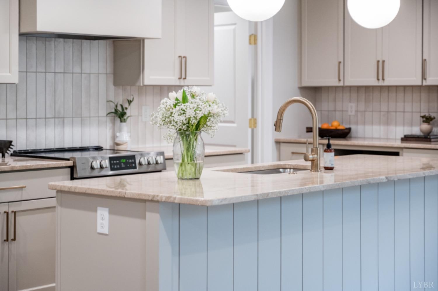 240 Ned Brown Road Amherst, VA 24521 - Photo 26 of 59 a kitchen with sink a window and potted plant