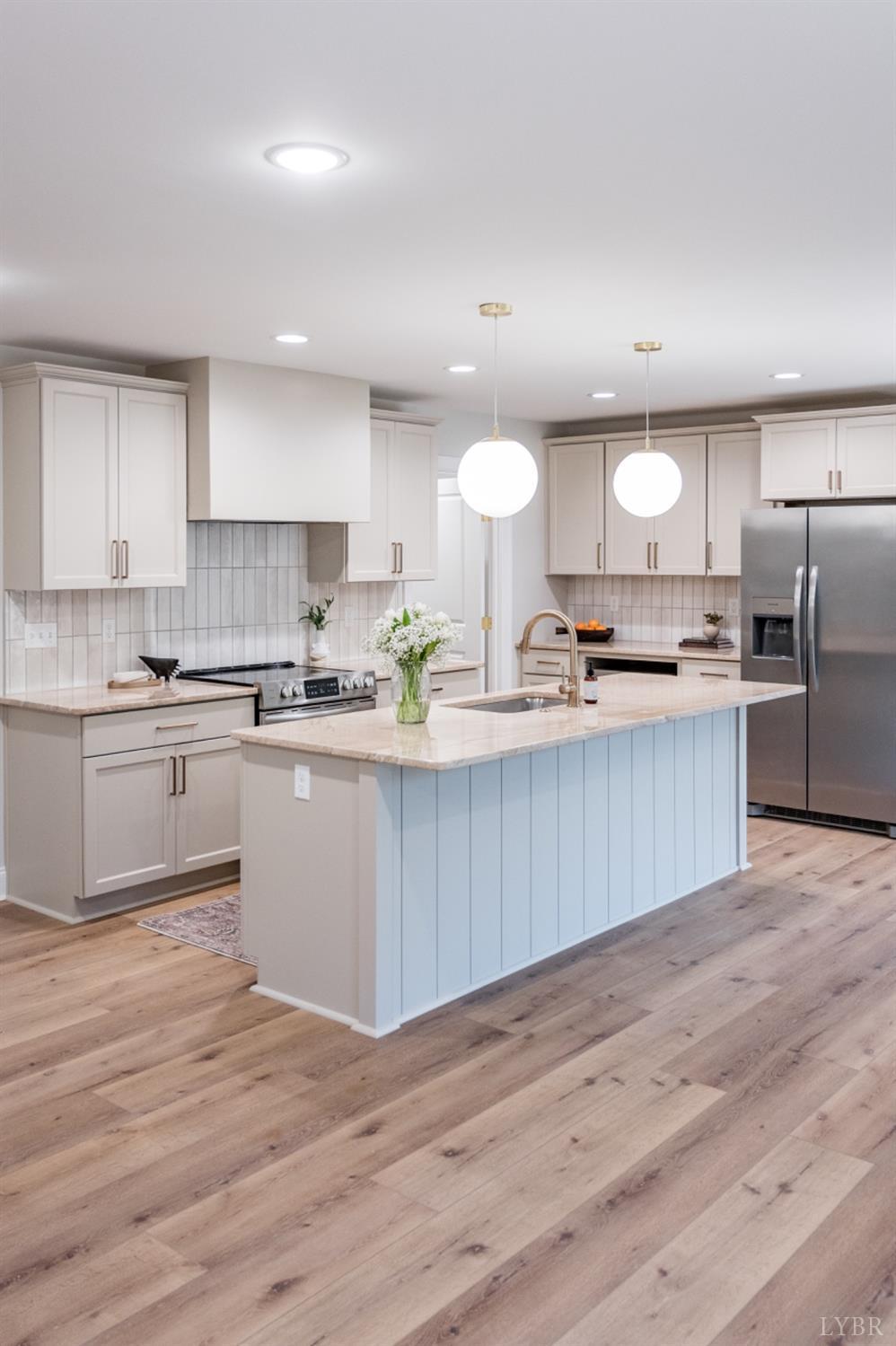 240 Ned Brown Road Amherst, VA 24521 - Photo 27 of 59 a kitchen with stainless steel appliances a sink a stove a refrigerator and cabinets