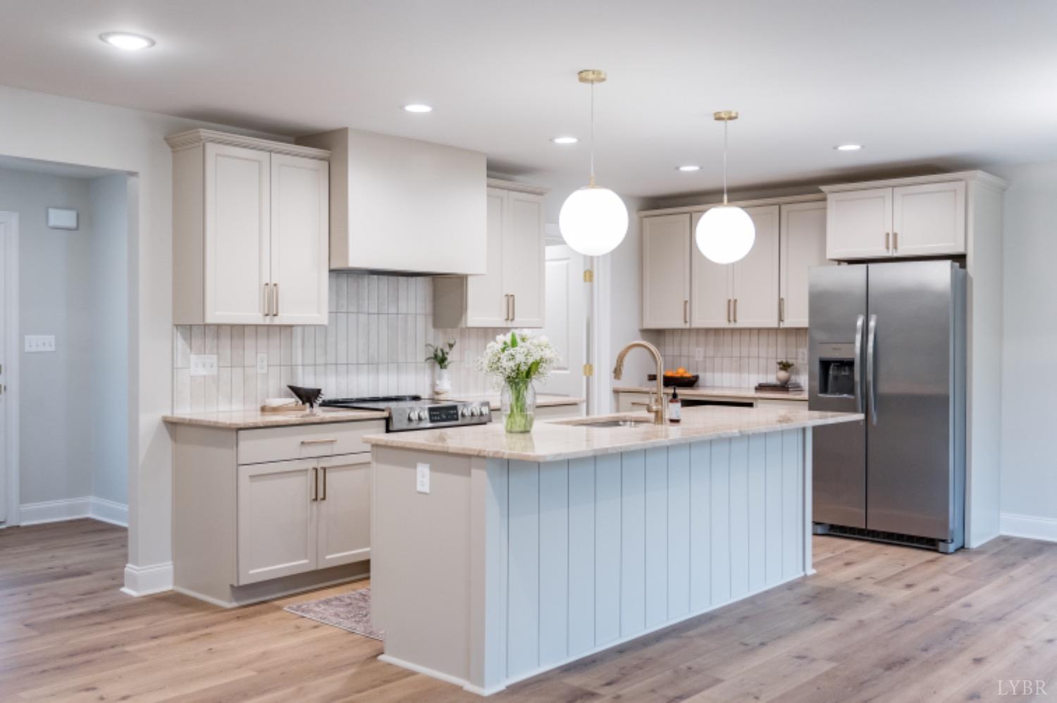 240 Ned Brown Road Amherst, VA 24521 - Photo 30 of 59 a kitchen with stainless steel appliances granite countertop a sink a stove and a refrigerator