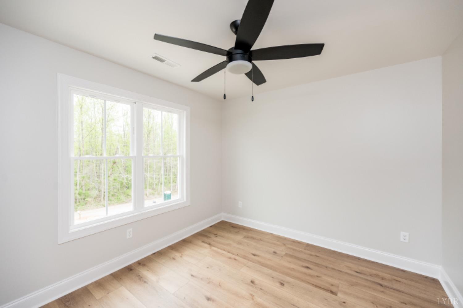240 Ned Brown Road Amherst, VA 24521 - Photo 34 of 59 a view of empty room with wooden floor