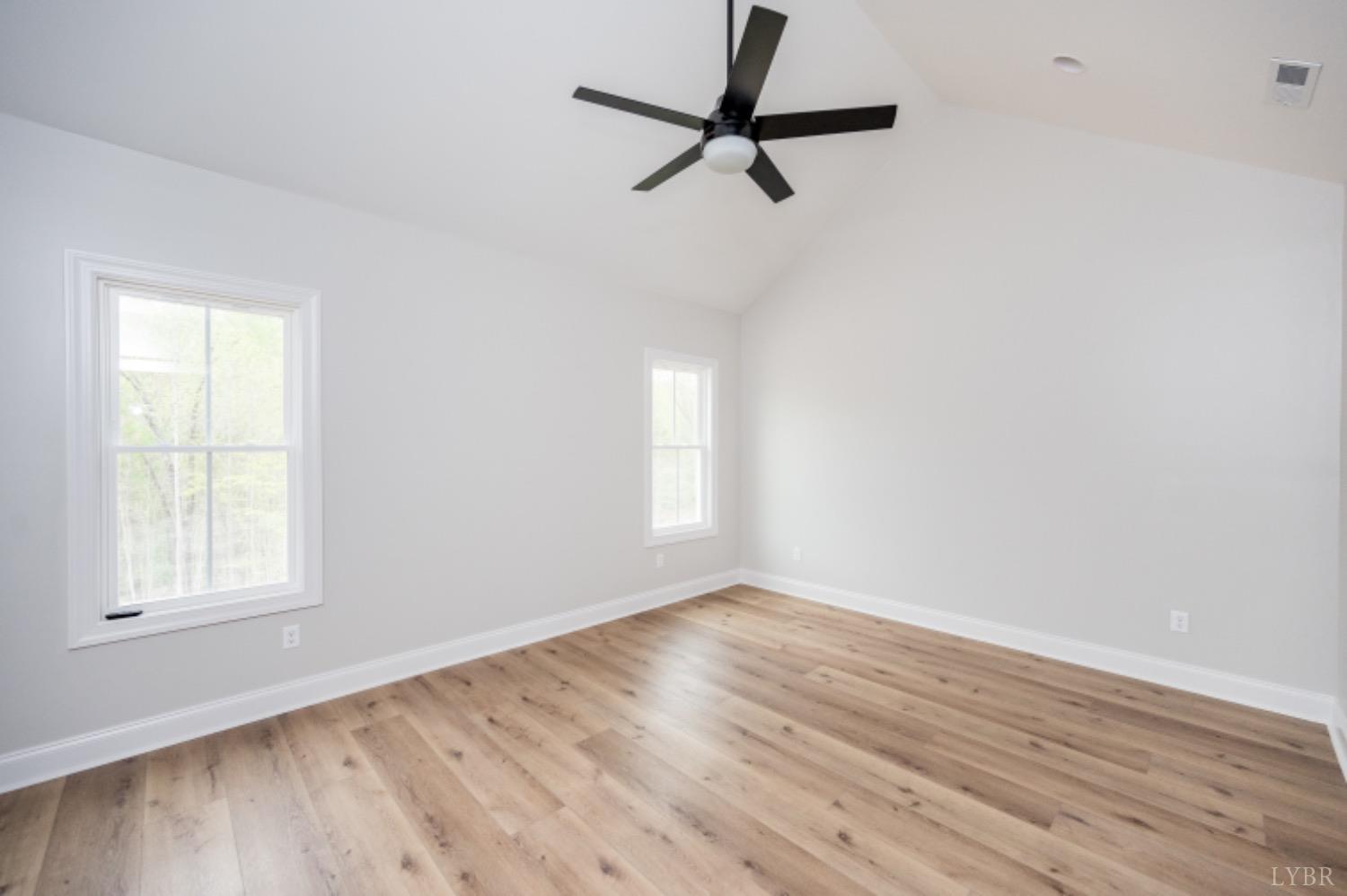 240 Ned Brown Road Amherst, VA 24521 - Photo 38 of 59 an empty room with wooden floor closet and windows