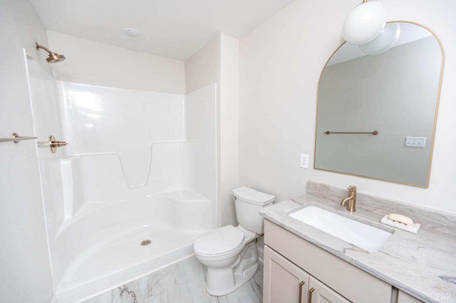 240 Ned Brown Road Amherst, VA 24521 - Photo 42 of 59 a bathroom with a granite countertop sink toilet and shower