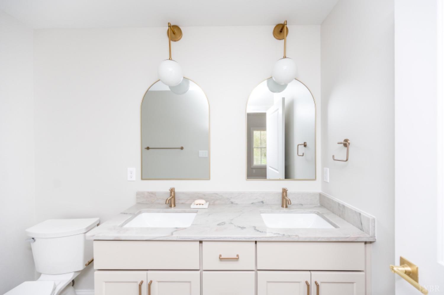 240 Ned Brown Road Amherst, VA 24521 - Photo 43 of 59 a bathroom with a sink and a mirror