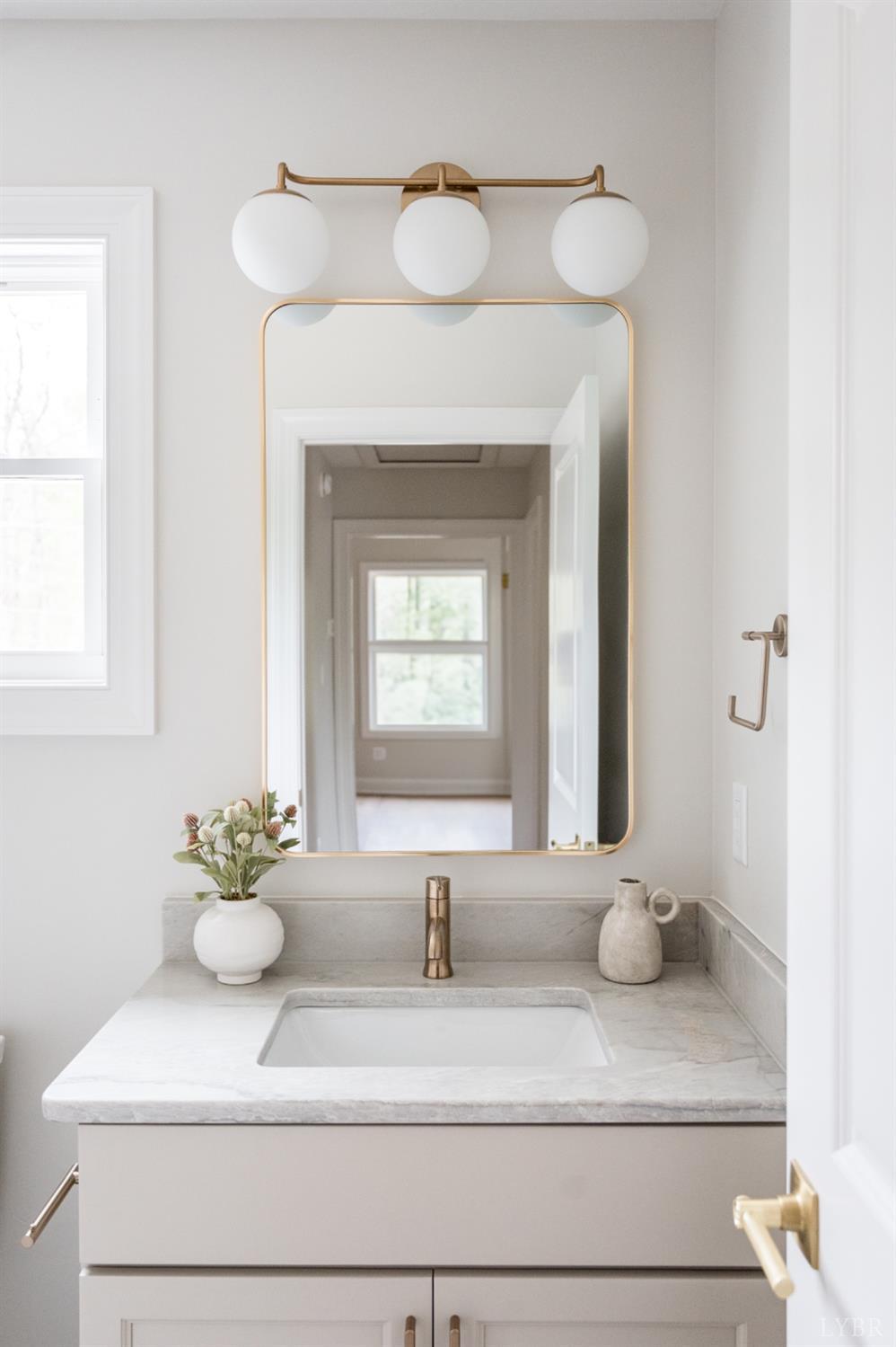 240 Ned Brown Road Amherst, VA 24521 - Photo 44 of 59 a bathroom with a sink and a mirror