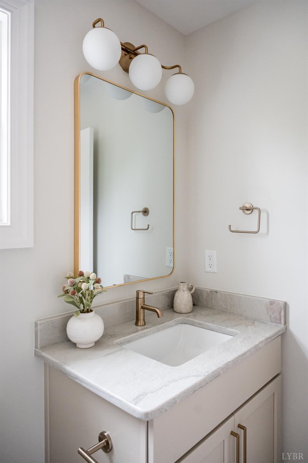 240 Ned Brown Road Amherst, VA 24521 - Photo 46 of 59 a bathroom with a sink and a mirror