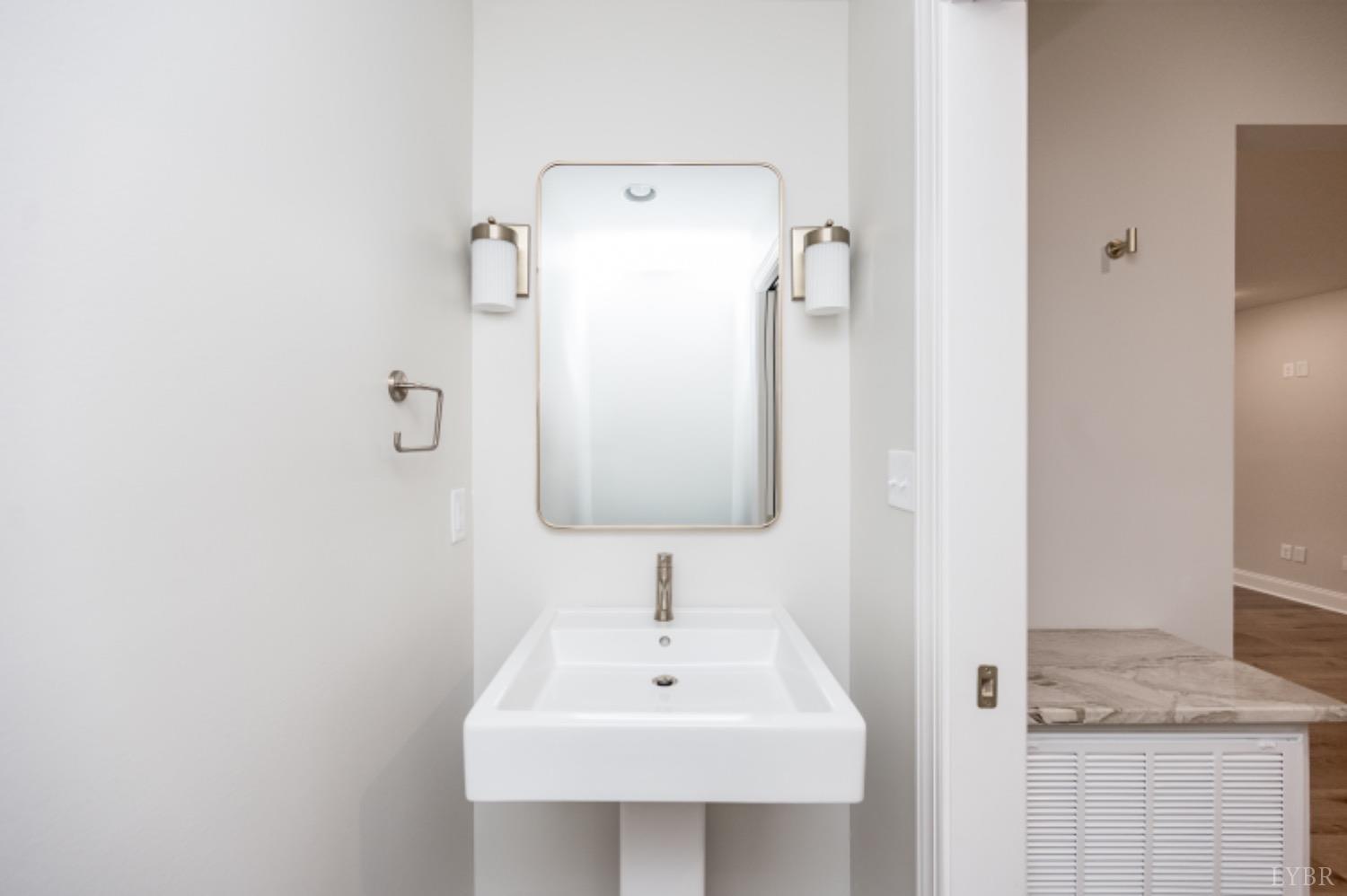 240 Ned Brown Road Amherst, VA 24521 - Photo 50 of 59 a bathroom with a sink a mirror and shower