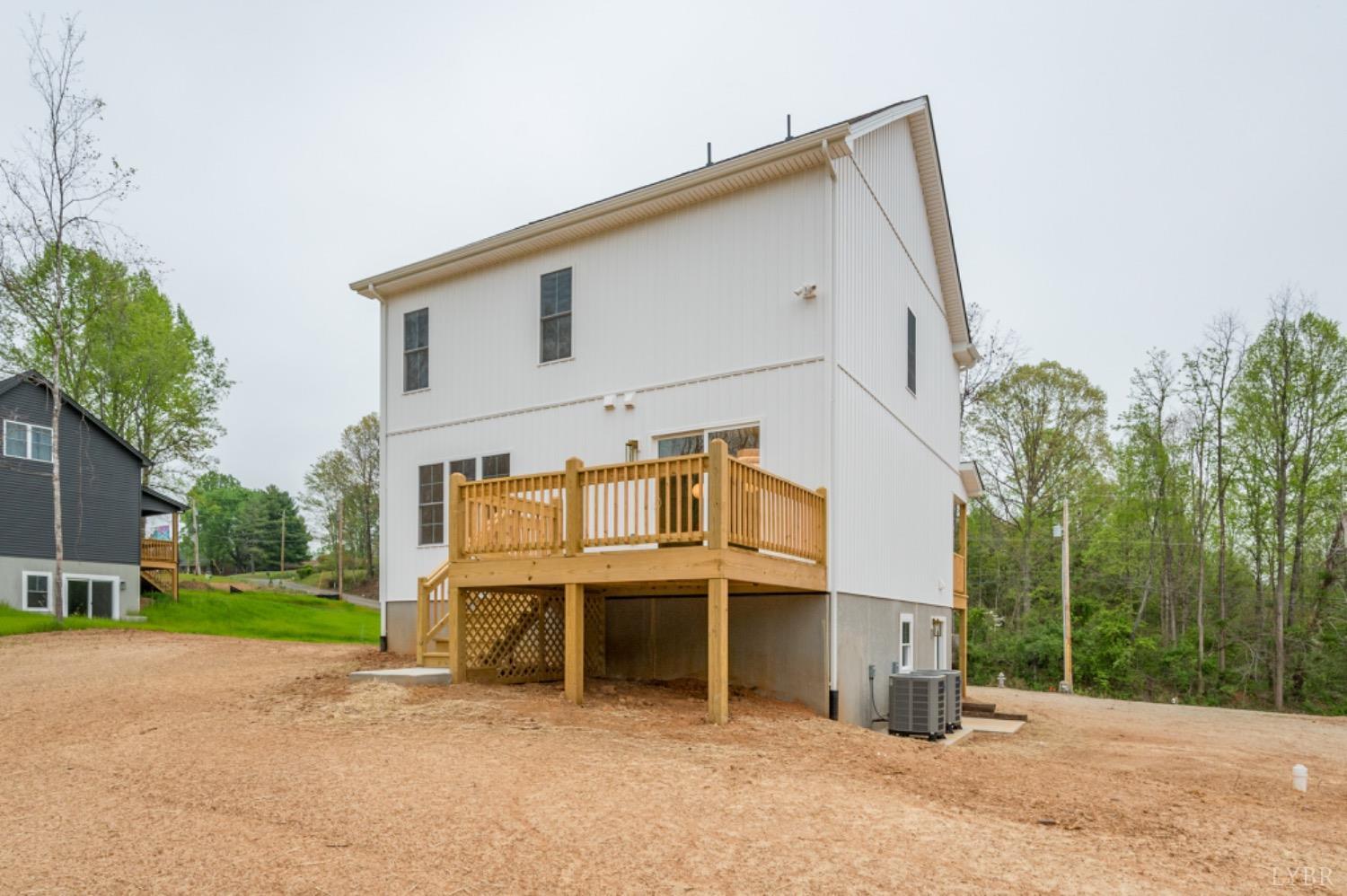 240 Ned Brown Road Amherst, VA 24521 - Photo 54 of 59 a view of a white house with a big yard and large trees