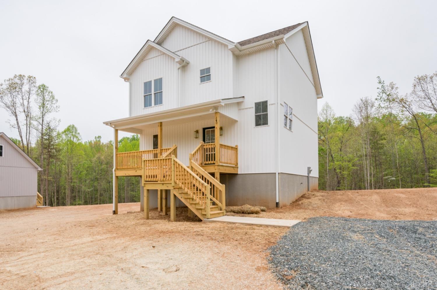240 Ned Brown Road Amherst, VA 24521 - Photo 59 of 59 a view of a white house with a yard and large tree