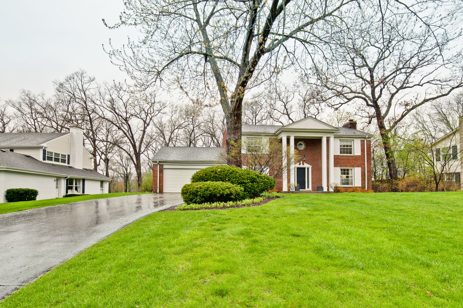 1040 Forest Hill Road Lake Forest, IL 60045 - Photo 2 of 30 a view of a house next to a big yard and large trees
