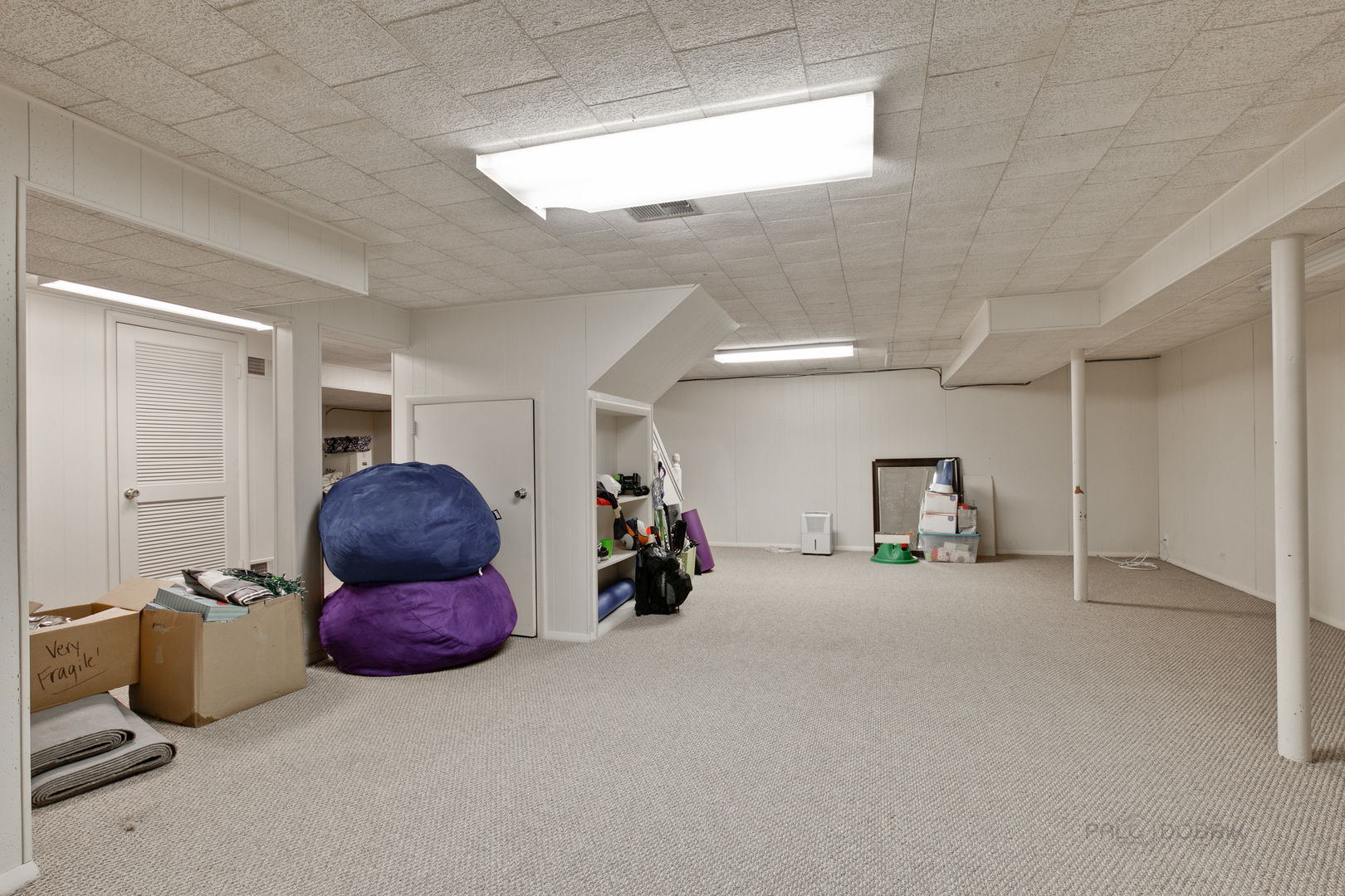 1040 Forest Hill Road Lake Forest, IL 60045 - Photo 25 of 30 a living room with furniture and a chandelier
