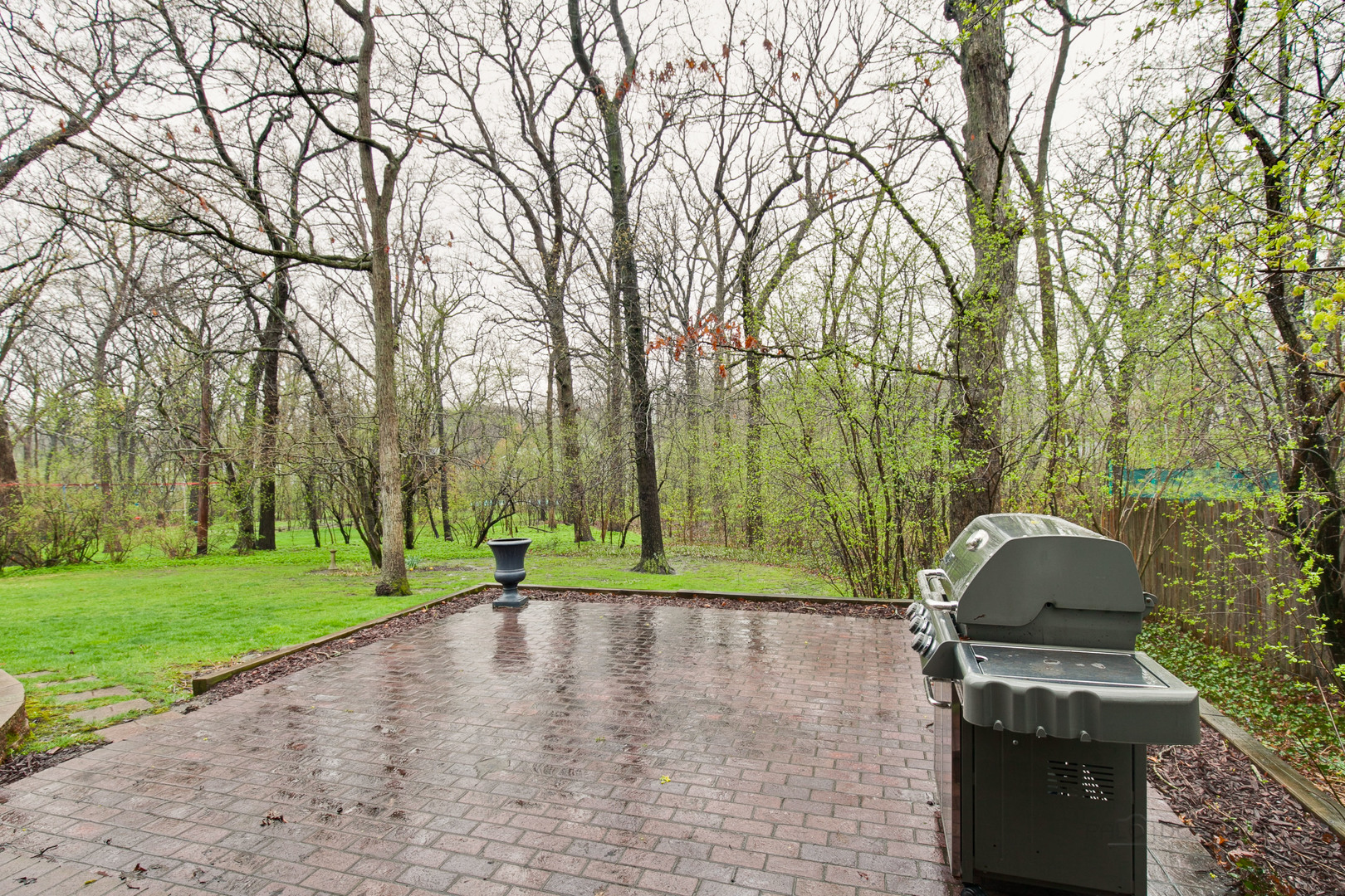 1040 Forest Hill Road Lake Forest, IL 60045 - Photo 26 of 30 a view of a backyard with trees