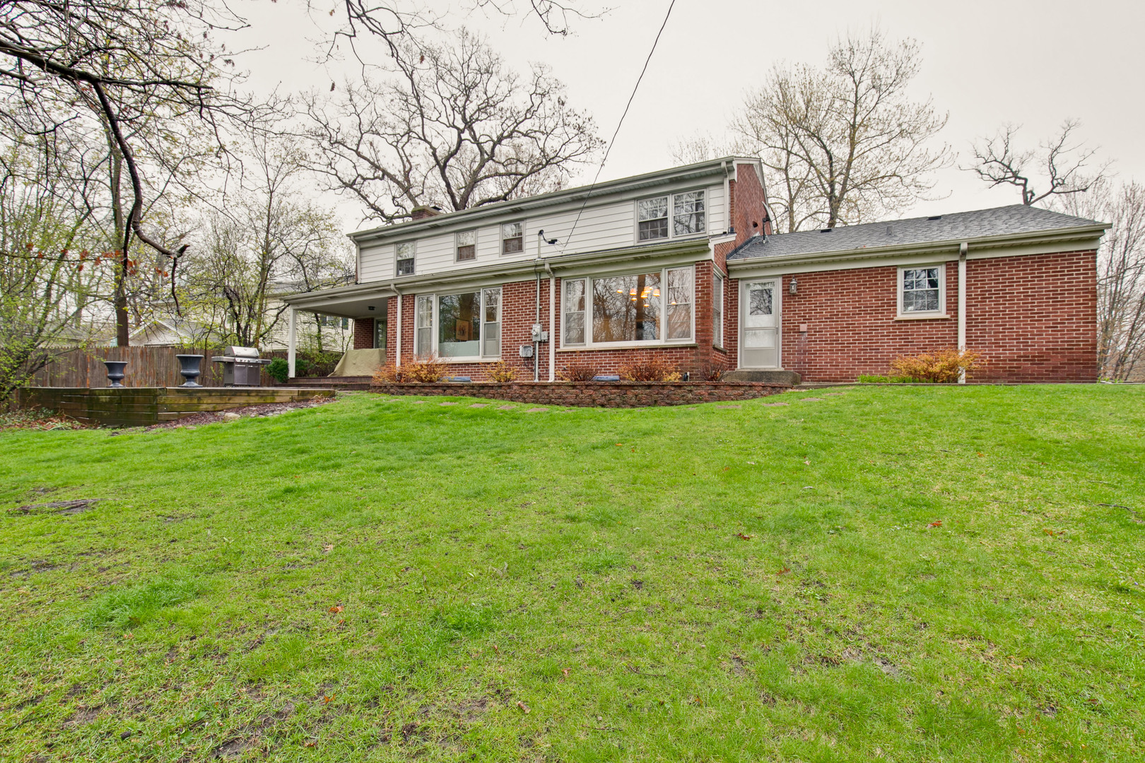 1040 Forest Hill Road Lake Forest, IL 60045 - Photo 28 of 30 a view of a house with a yard porch and sitting area