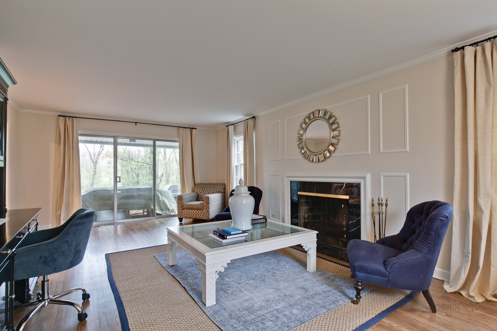 1040 Forest Hill Road Lake Forest, IL 60045 - Photo 7 of 30 a living room with furniture a fireplace and a large window