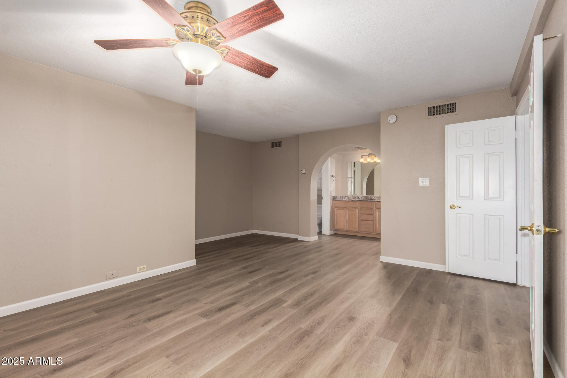 10410 North Cave Creek Road, Unit 1011 Phoenix, AZ 85020 - Photo 21 of 41 wooden floor in an empty room
