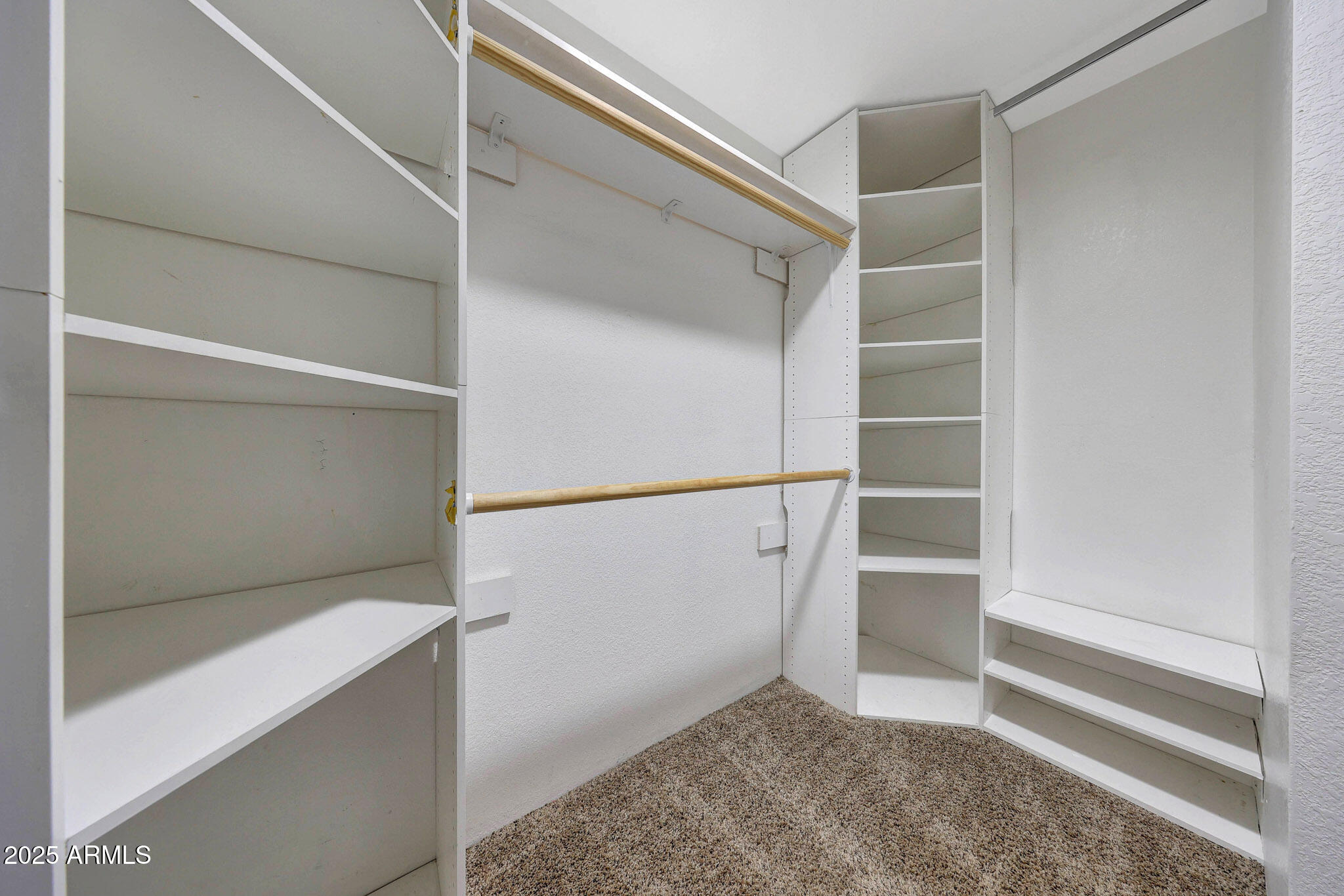 10410 North Cave Creek Road, Unit 1011 Phoenix, AZ 85020 - Photo 24 of 41 a view of an empty walk in closet