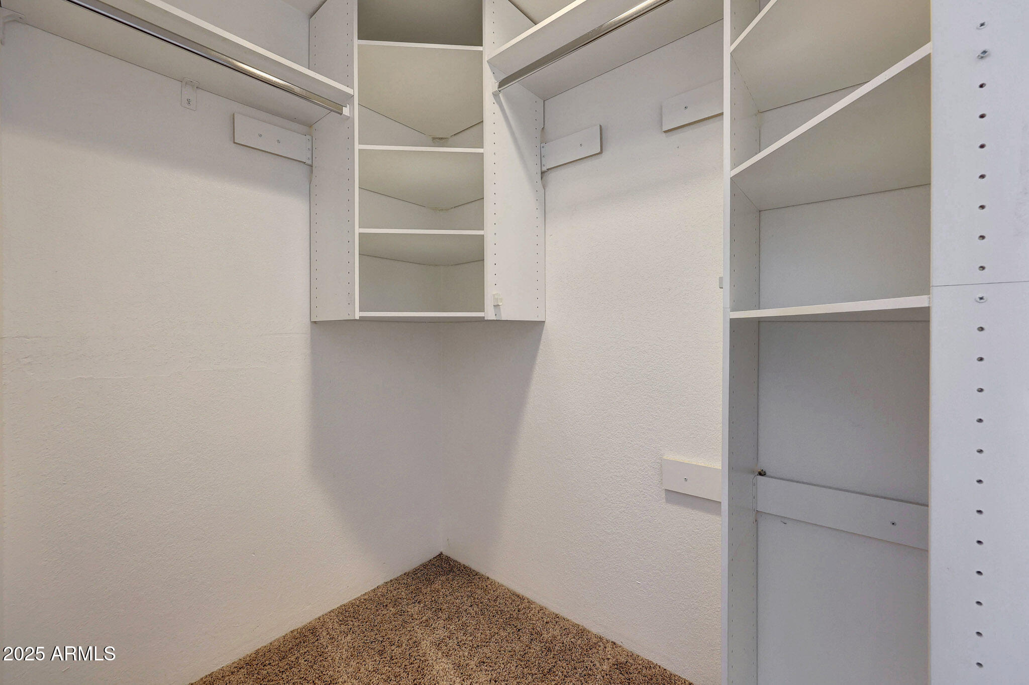 10410 North Cave Creek Road, Unit 1011 Phoenix, AZ 85020 - Photo 34 of 41 a view of walk in closet with empty racks