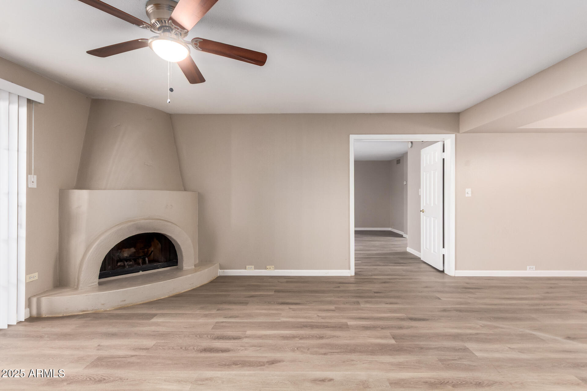 10410 North Cave Creek Road, Unit 1011 Phoenix, AZ 85020 - Photo 8 of 41 a view of a livingroom with a fireplace and wooden floor