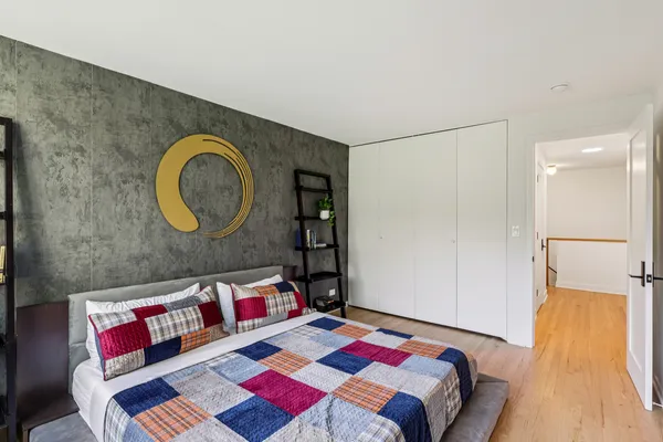 a living room with a couch and dresser