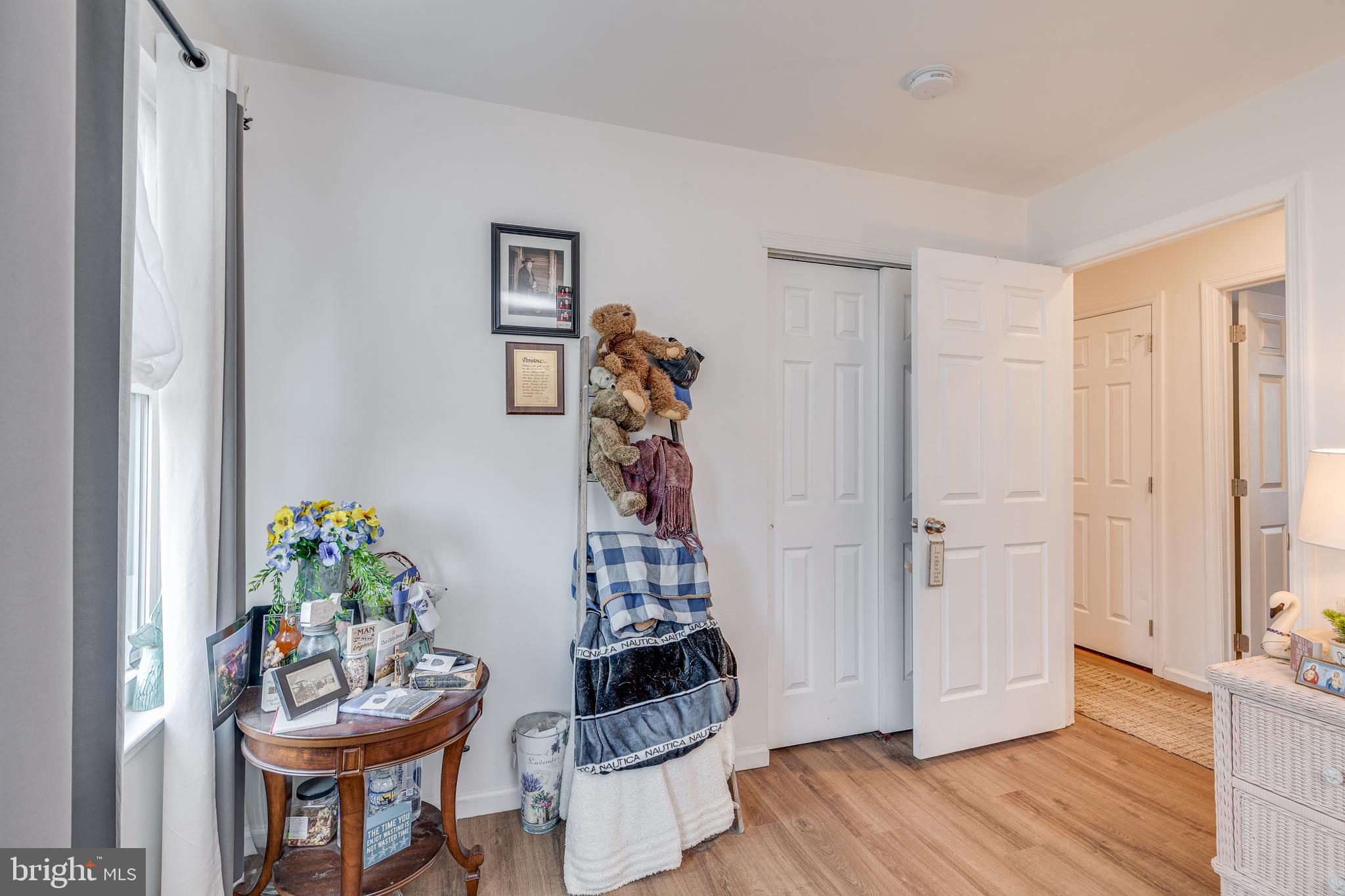 1030 Center Street Tuckerton, NJ 08087 - Photo 14 of 42 a view of a hallway with furniture and wooden floor