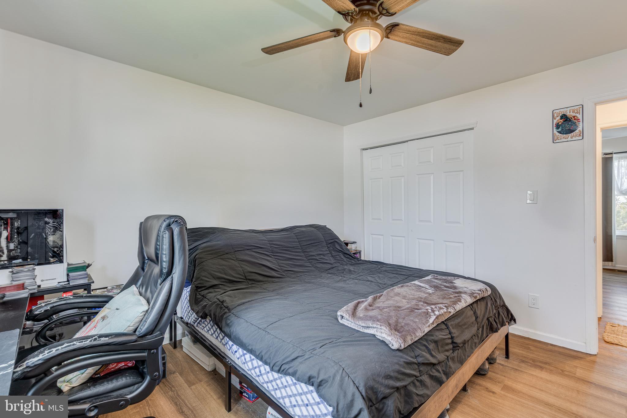 1030 Center Street Tuckerton, NJ 08087 - Photo 18 of 42 a bedroom with a bed and a chandelier