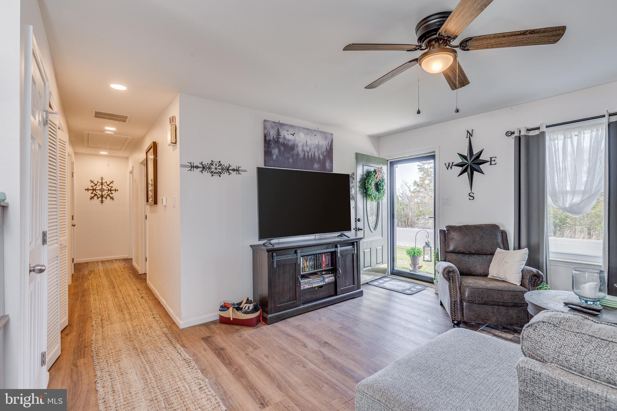 1030 Center Street Tuckerton, NJ 08087 - Photo 5 of 42 a living room with furniture and a flat screen tv