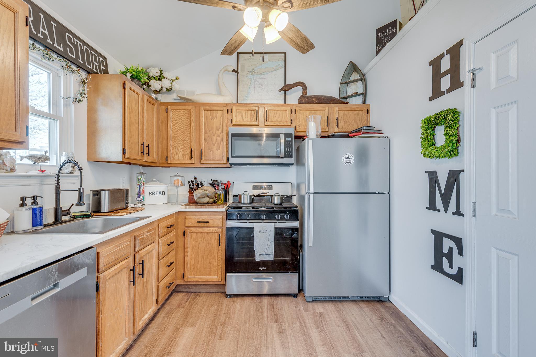 1030 Center Street Tuckerton, NJ 08087 - Photo 10 of 42 a kitchen with stainless steel appliances granite countertop a refrigerator a stove and a sink