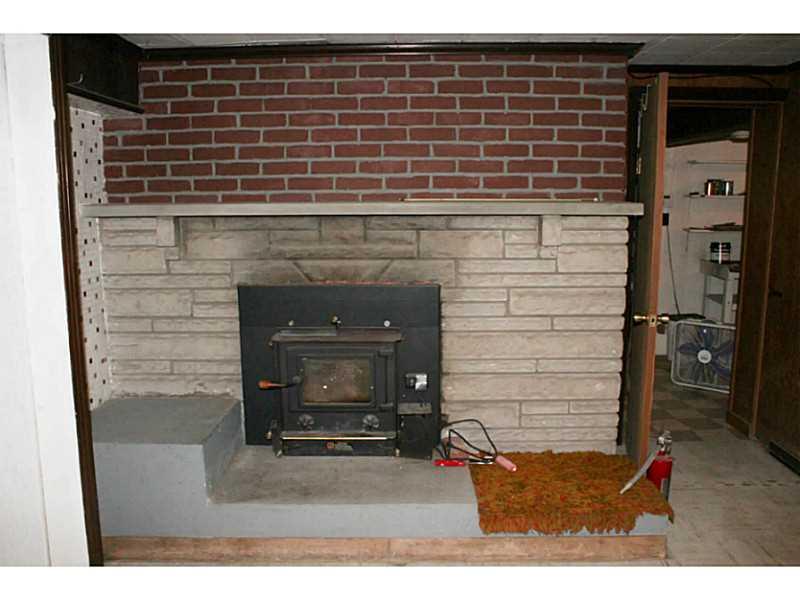 407 Baldwin Road Carnegie, PA 15106 - Photo 18 of 24 Basement/Game Room. Small wood burning fireplace in game room / bar room in basement