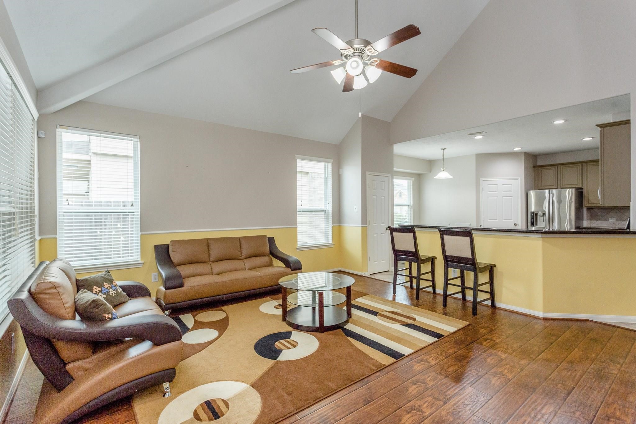 3430 Lilac Ranch Drive Katy, TX 77494 - Photo 7 of 29 a living room with furniture and a wooden floor