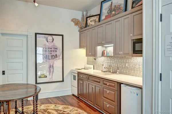 a bathroom with a sink a vanity and a mirror