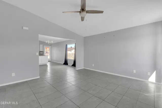 an empty room with windows and entrance