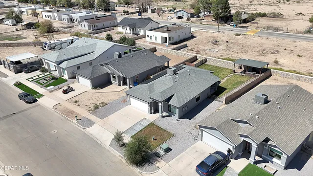 an aerial view of a house with swimming pool