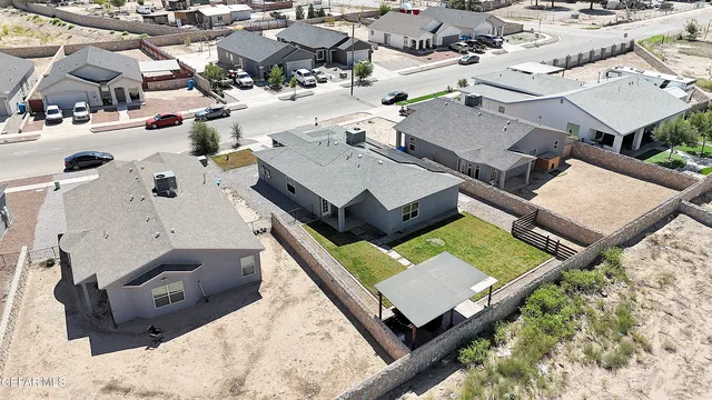 an aerial view of a house with a swimming pool