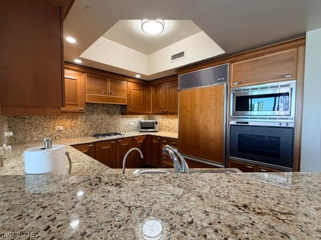 2777 Paradise Road, Unit 807 Las Vegas, NV 89109 - Photo 36 of 61 Premium granite counters and integrated appliances elevate this modern kitchen space.