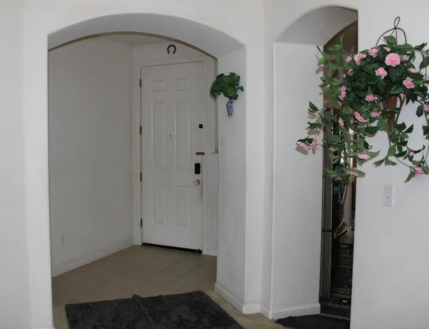 a view of entryway with wooden floor