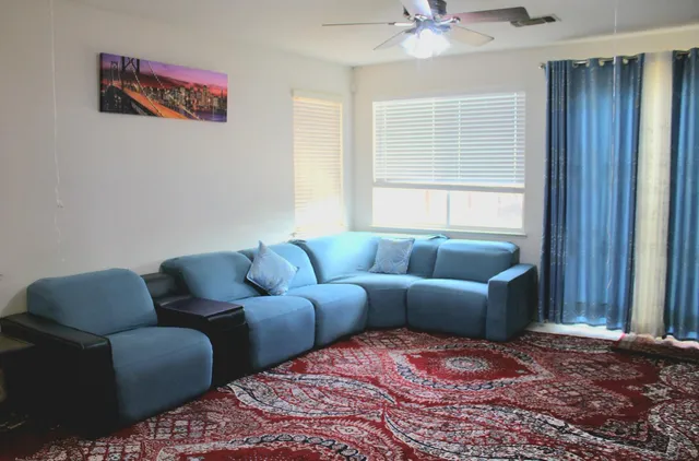 a living room with furniture and a window