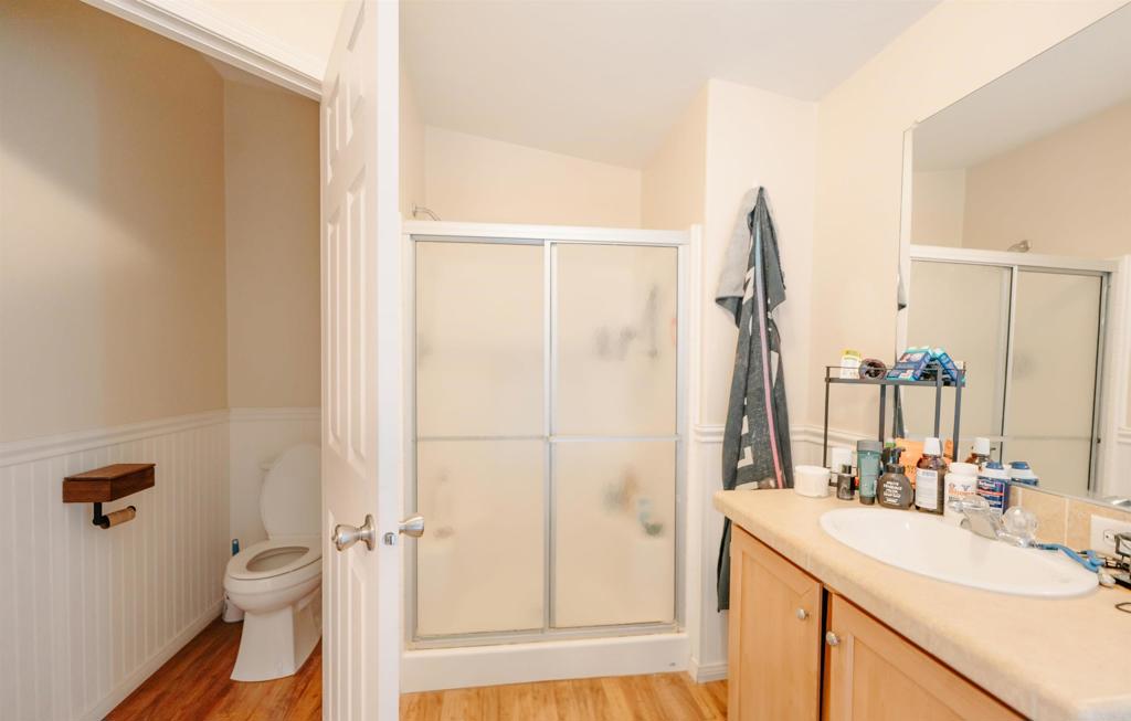 4740 Flying H Road Twentynine Palms, CA 92277 - Photo 11 of 19 a bathroom with a sink vanity mirror and toilet