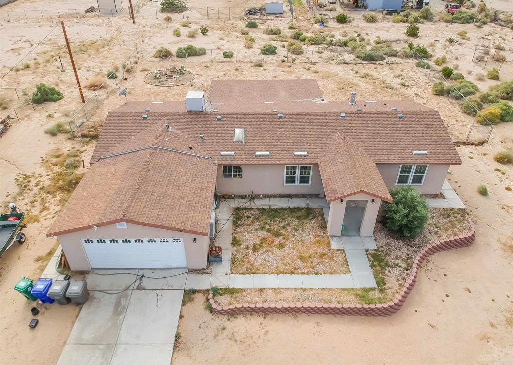 4740 Flying H Road Twentynine Palms, CA 92277 - Photo 16 of 19 an aerial view of a house with a yard and covered with snow