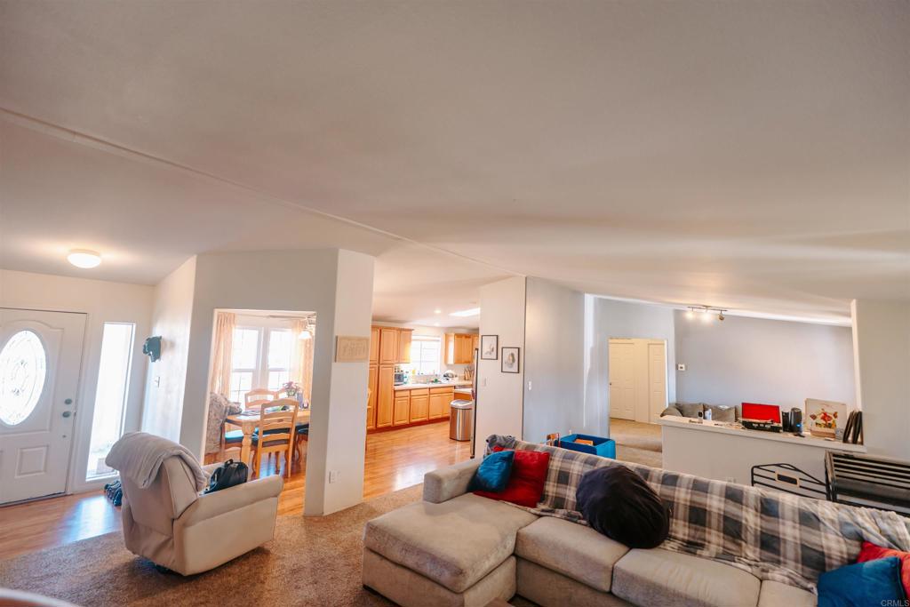 4740 Flying H Road Twentynine Palms, CA 92277 - Photo 6 of 19 a living room with furniture and a wooden floor