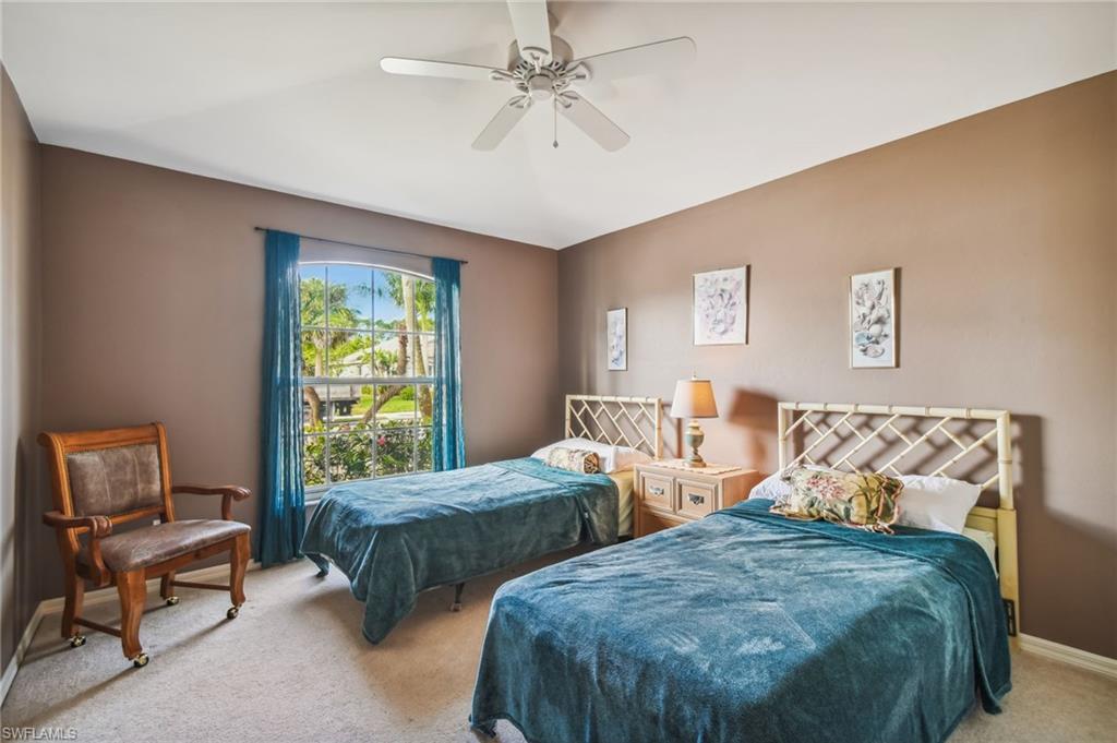 21629 Windham Run Estero, FL 33928 - Photo 12 of 23 a bedroom with two beds and a window