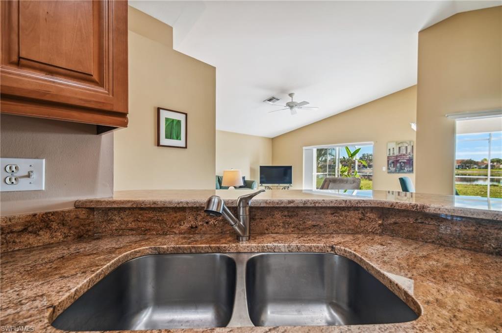 21629 Windham Run Estero, FL 33928 - Photo 7 of 23 a kitchen with a sink and a window