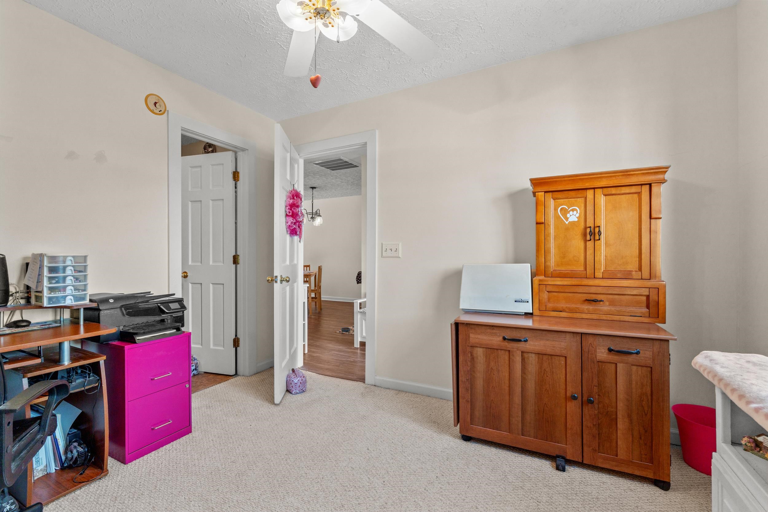 3015 Old Bryan Drive, Unit 97 Myrtle Beach, SC 29577 - Photo 22 of 35 Office with ceiling fan, a textured ceiling, light colored carpet, visible vents, and baseboards