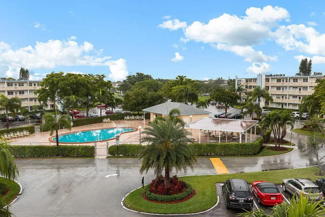 a view of a swimming pool and a yard