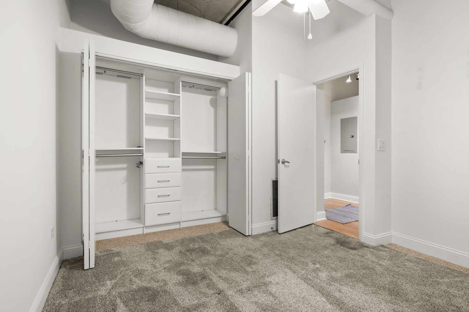 933 West Van Buren Street, Unit 508 Chicago, IL 60607 - Photo 18 of 25 wooden floor and closet in a room